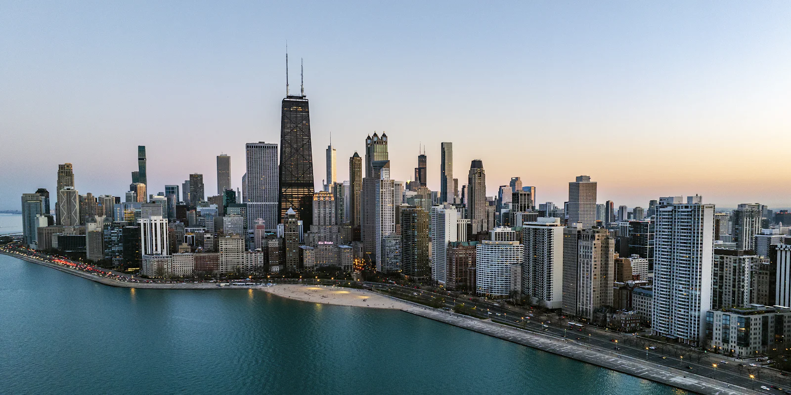 Chicago's lakefront skyline at dusk, seen from above