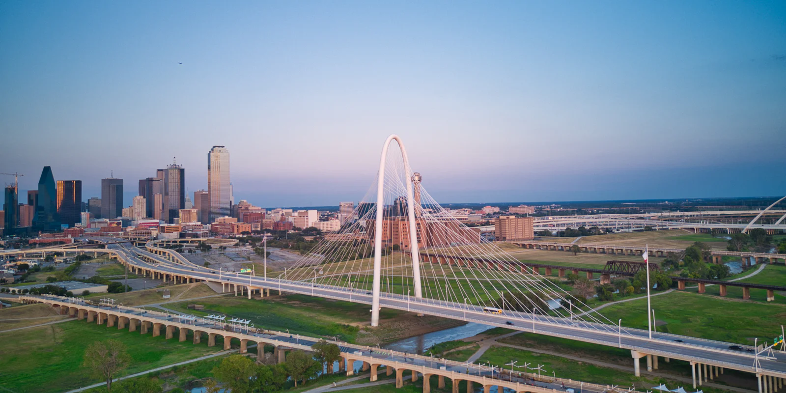 The Margaret Hunt Hill Bridge with the Dallas skyline behind