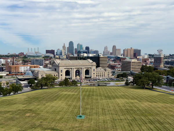 Union Station and the Kansas City skyline across a wide lawn