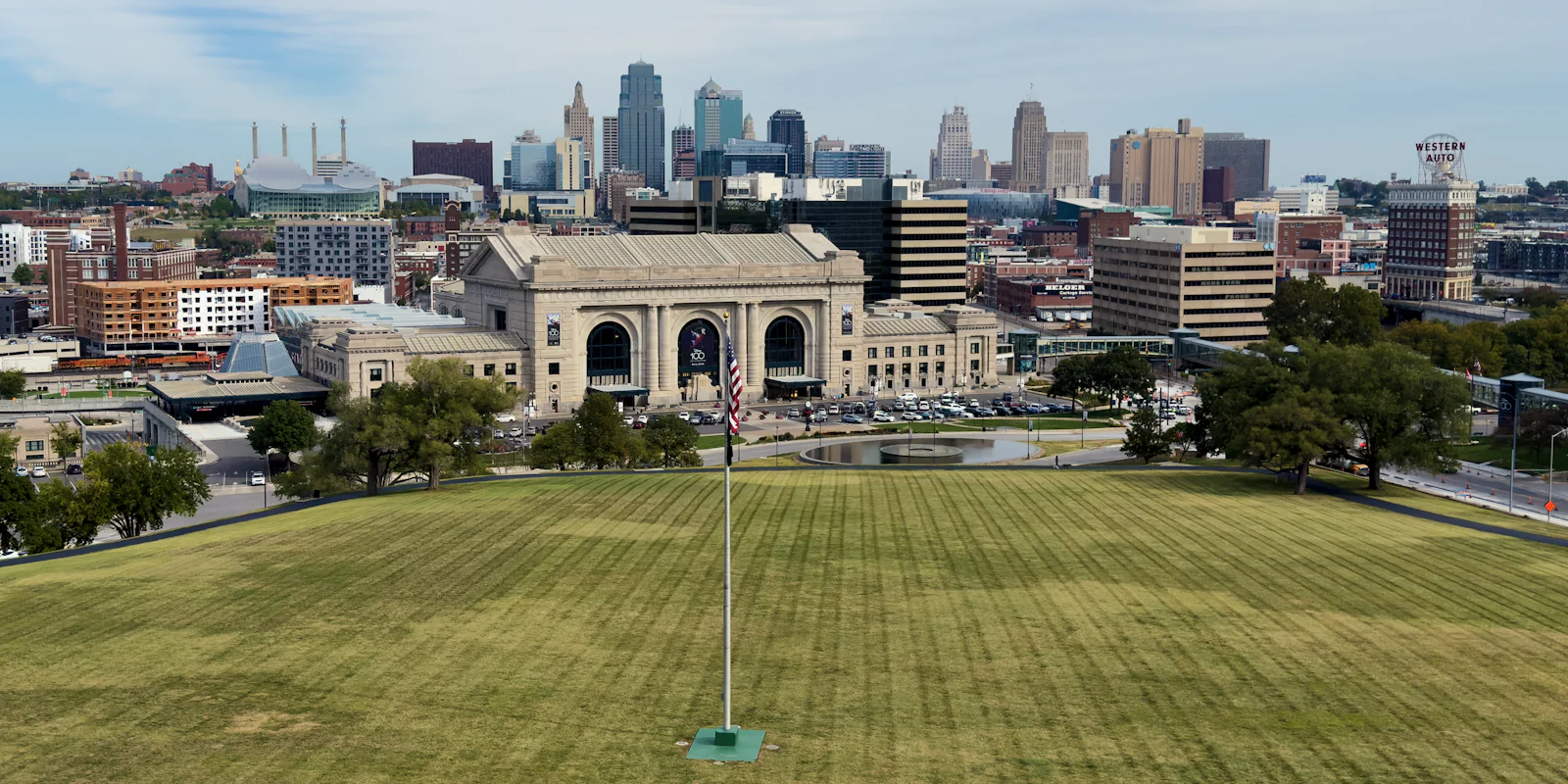 Union Station and the Kansas City skyline across a wide lawn