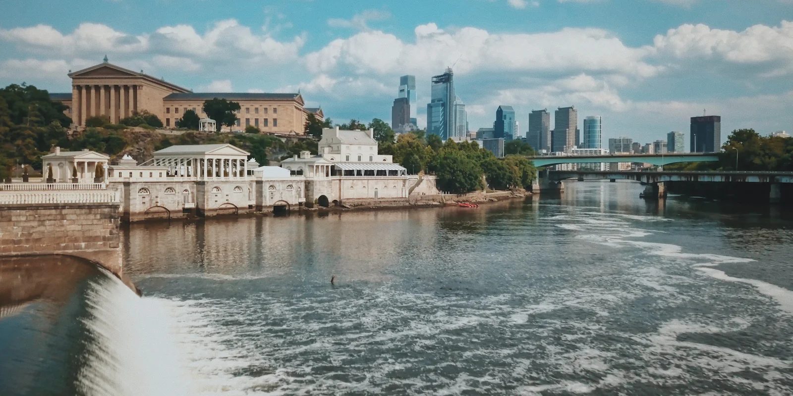 The Fairmount Water Works on the Schuylkill River with the Philadelphia skyline behind