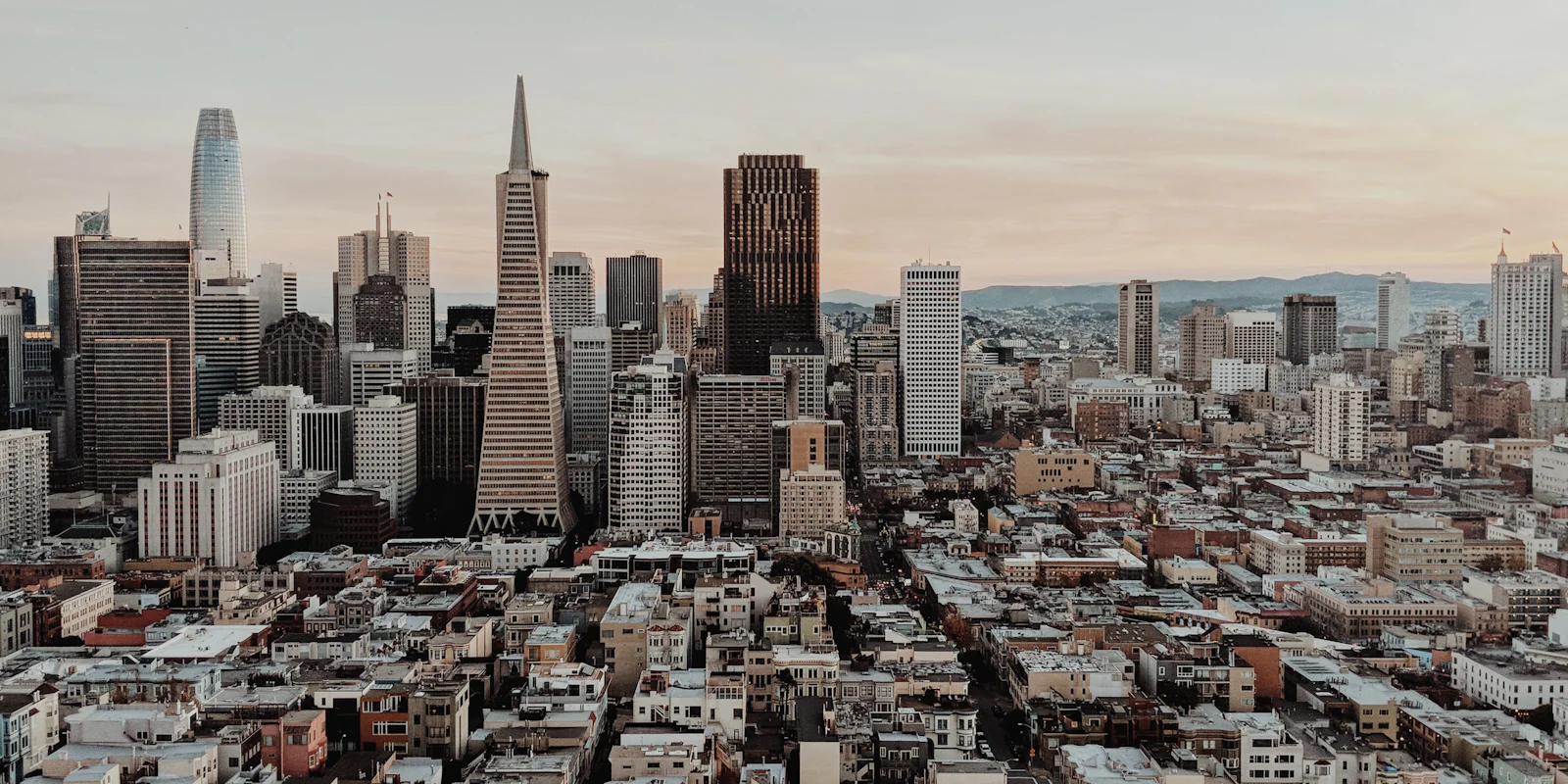 San Francisco rooftops and the Transamerica Pyramid in hazy daylight